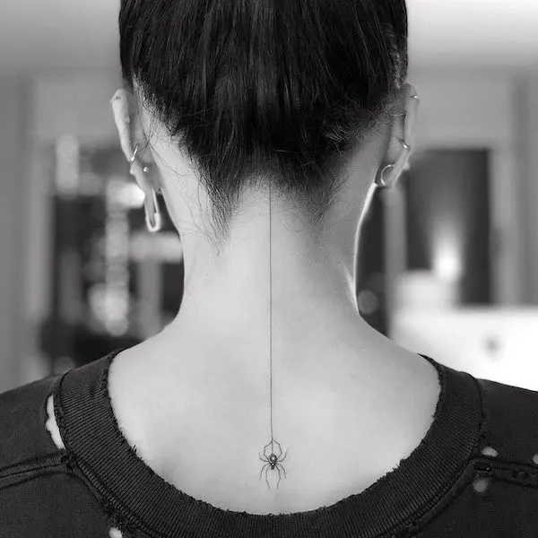 A spider nape tattoo