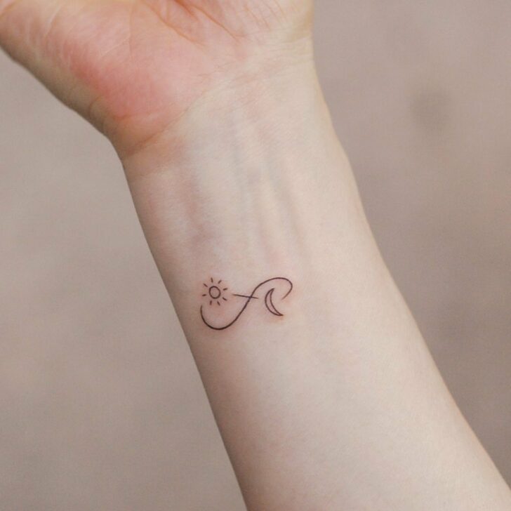 A sun and moon infinity tattoo