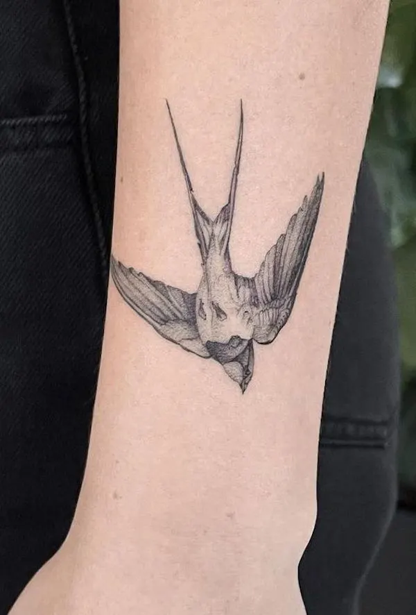 Black and grey bird tattoo