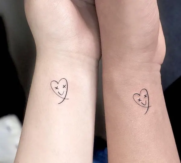 Cute small heart tattoos on the wrist