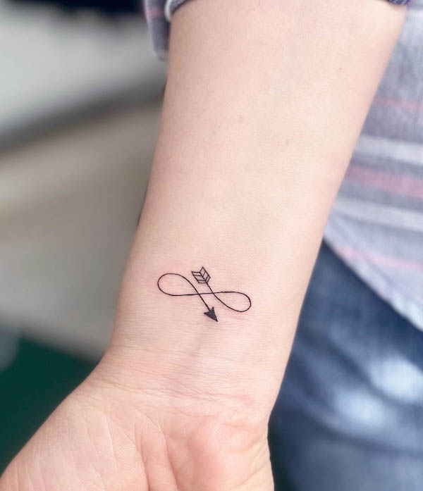 Cute small infinity arrow tattoo