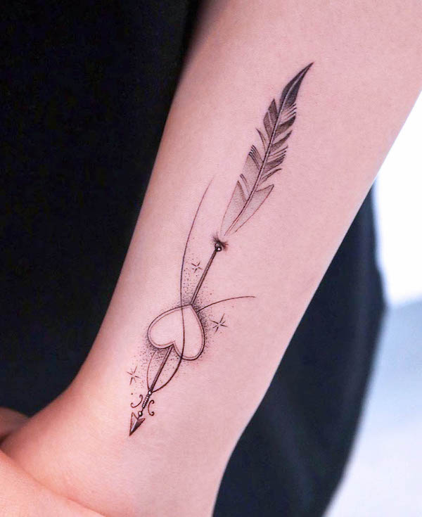 Feather and arrow tattoo