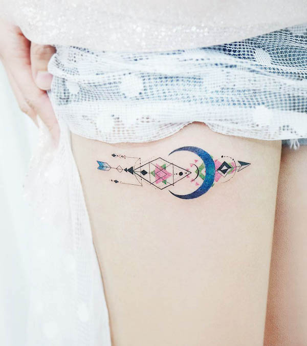 Geometric arrow thigh tattoo