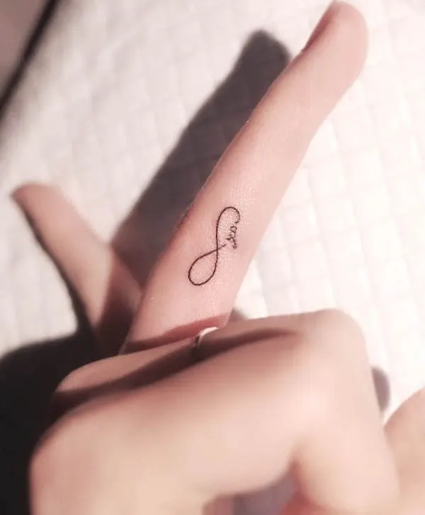 Infinity finger tattoo