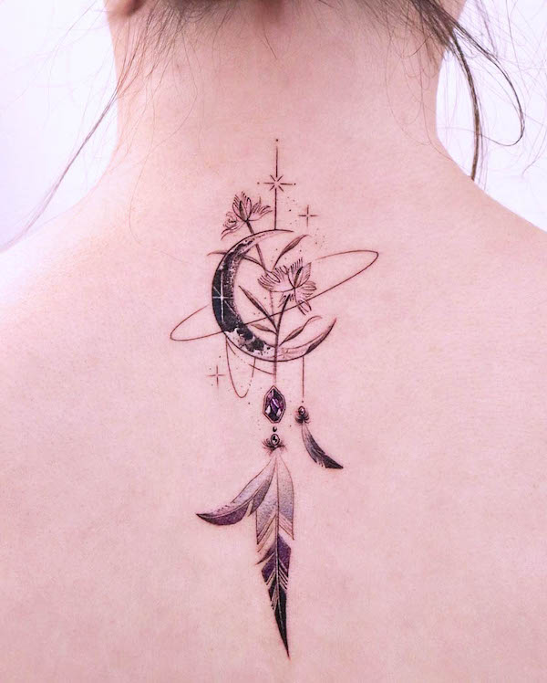 Moon and feather back tattoo