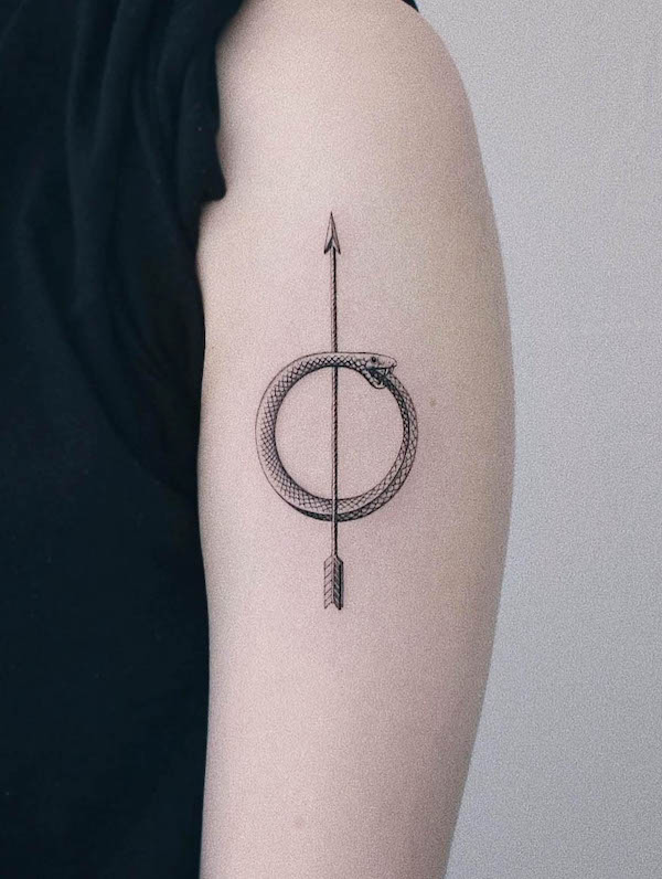 Ouroboros arrow tattoo