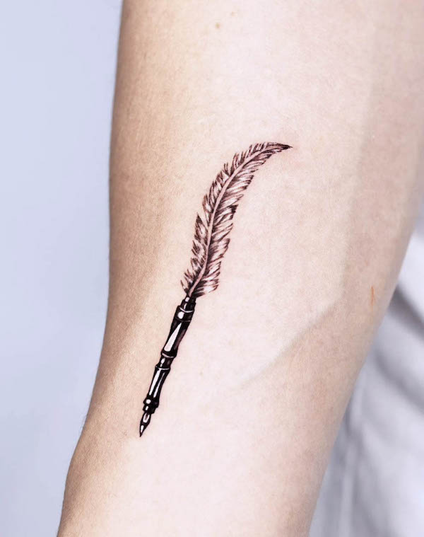 Pen and feather tattoo