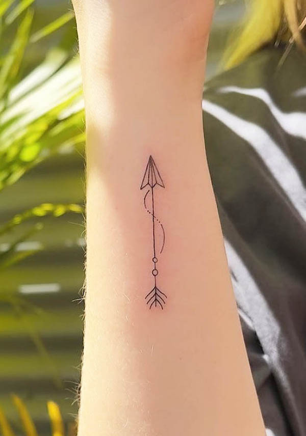 Small arrow wrist tattoo