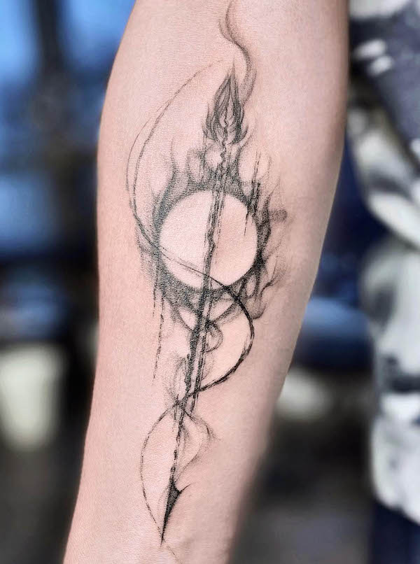 Sun and arrow tattoo