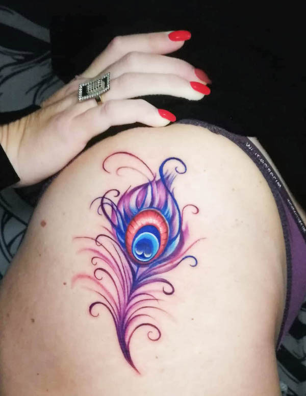 Vibrant peacock feather tattoo