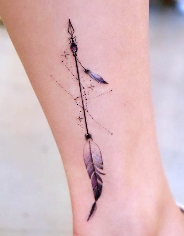 Zodiac and arrow feather tattoo