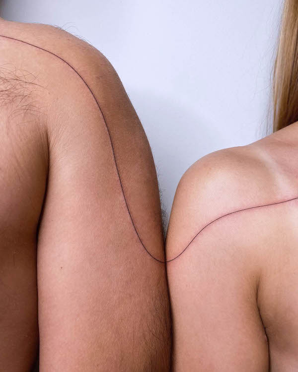 Connected lines matching couple tattoos