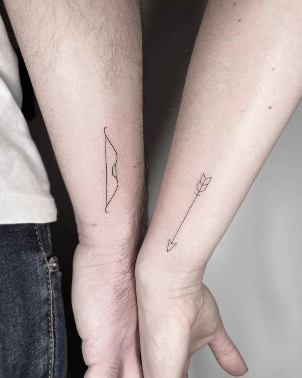 Matching bow and arrow couple tattoos