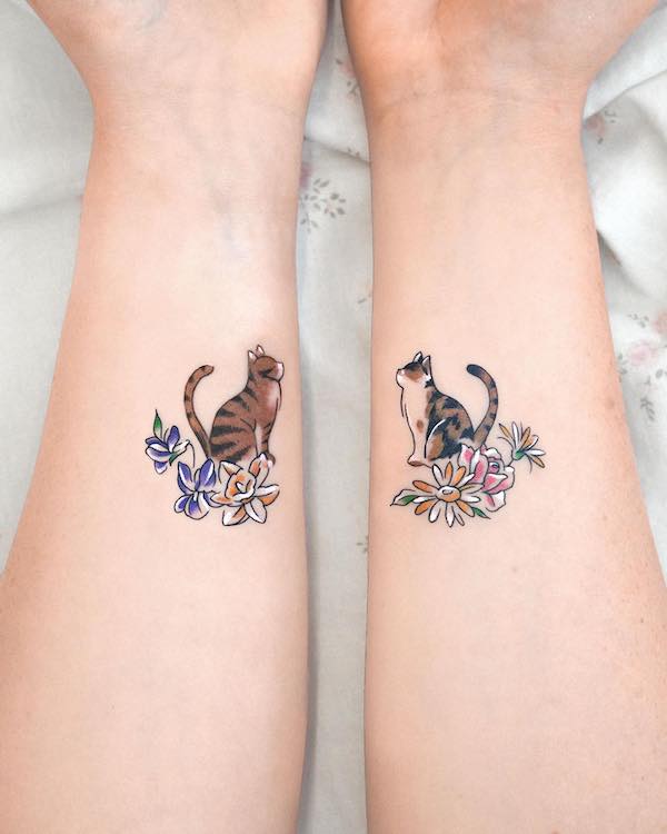 Matching cat tattoos