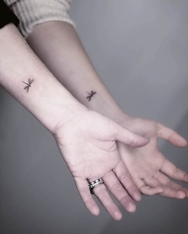 Matching dragonfly wrist tattoos