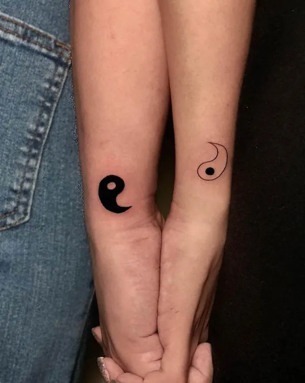 Simple yin yang couple tattoos