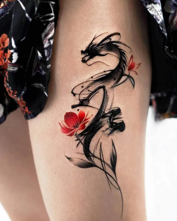 Black dragon thigh tattoo