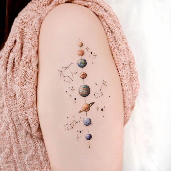 Intricate planets and stars sleeve tattoo