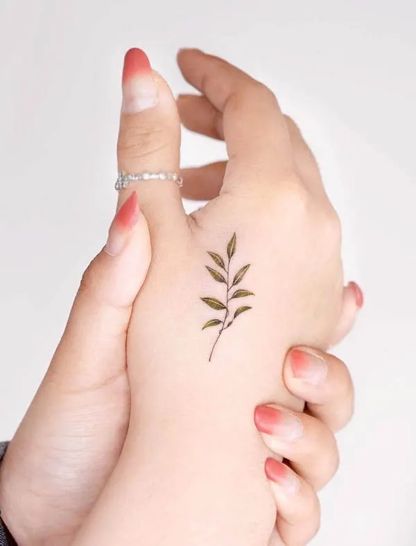 Small botanical hand tattoo