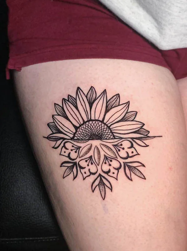 Sunflower thigh tattoo