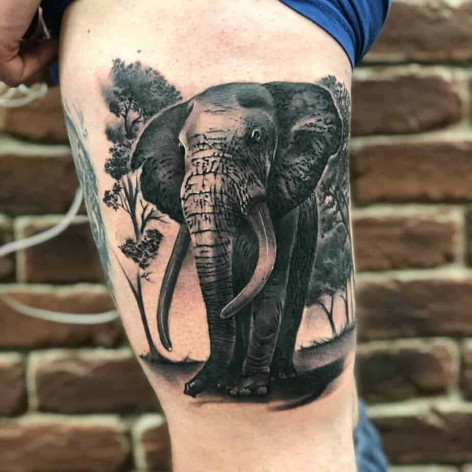 black & grey elephant thigh tattoo