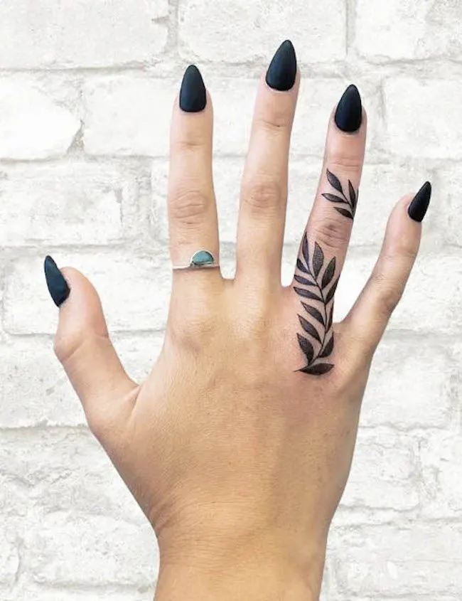 A vine tattoo on the ring finger