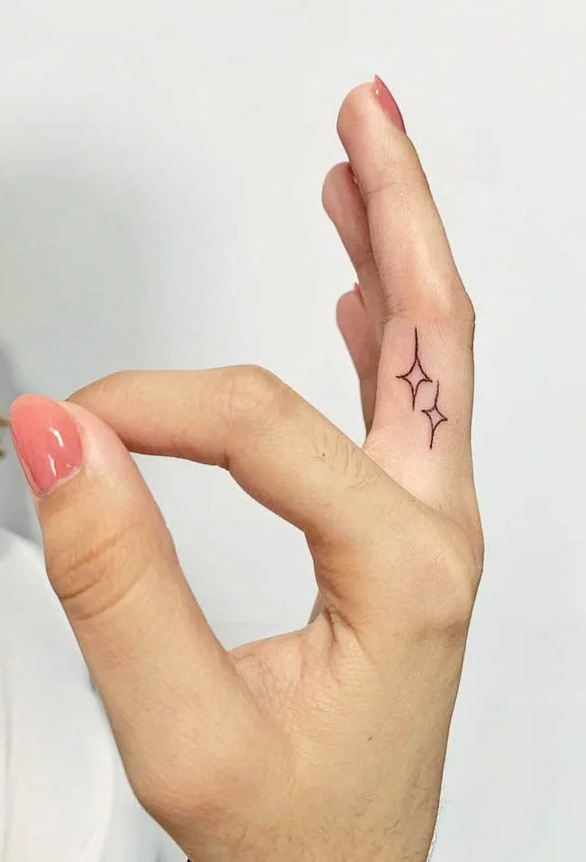 An inner finger tattoo that shines