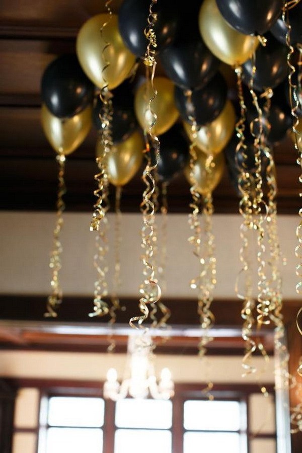 Black And Gold Balloons With Gold Ribbons.