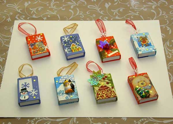 Reuse matchboxes as christmas ornament .. and you can put a surprise inside too.