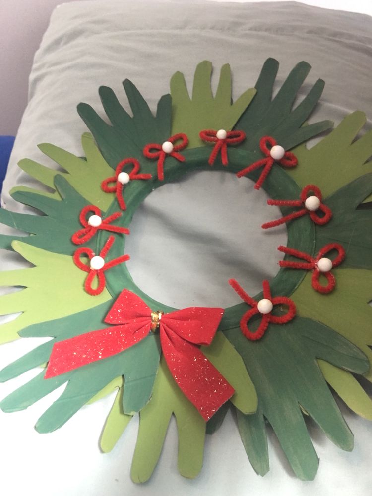 Kids will love making this handprint wreath to give as a gift.