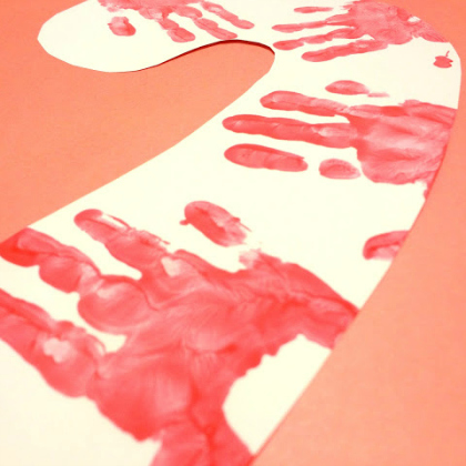 Handprints to make candy cane art.