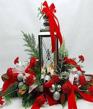 Silver Christmas Decorations Accented with Red and Silver Velvet Ribbons.