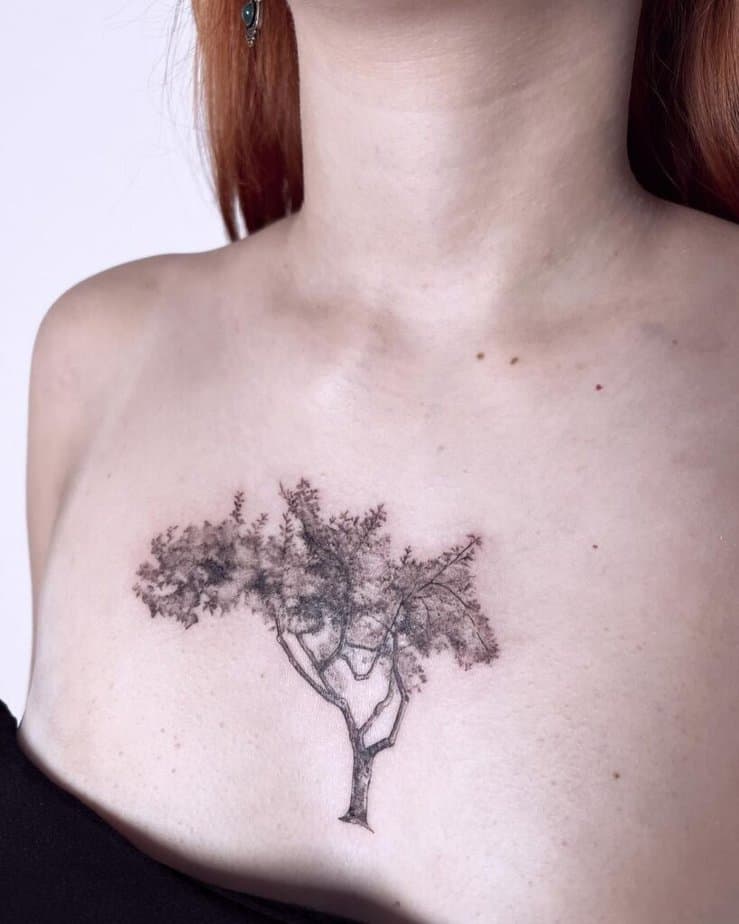 An apple tree tattoo on the chest