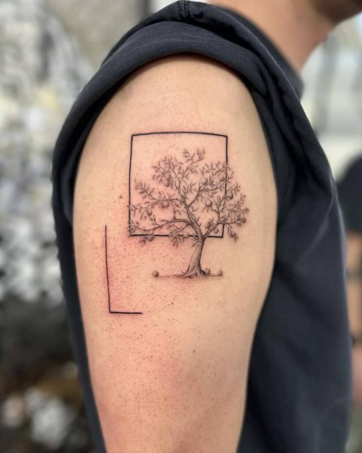 An apple tree tattoo with geometric shapes