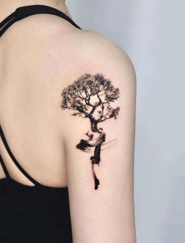 Black brush stroke tree tattoo on the shoulder