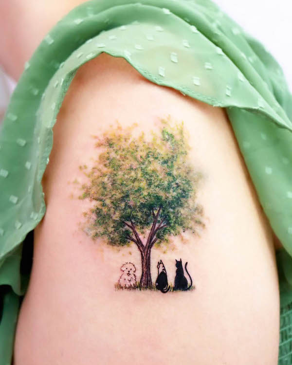 Cats and dog under the tree tattoo